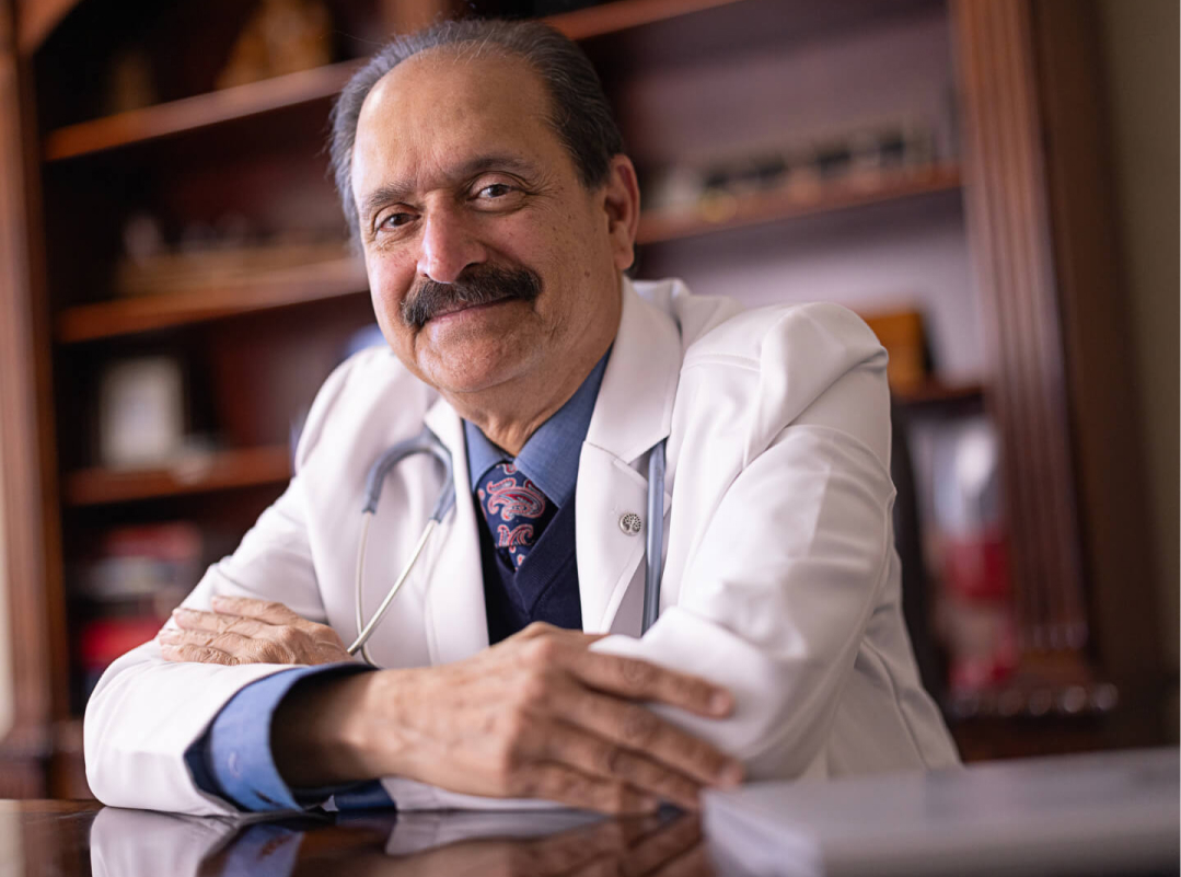 50 | 50 image Physician wearing white lab coat and smiling